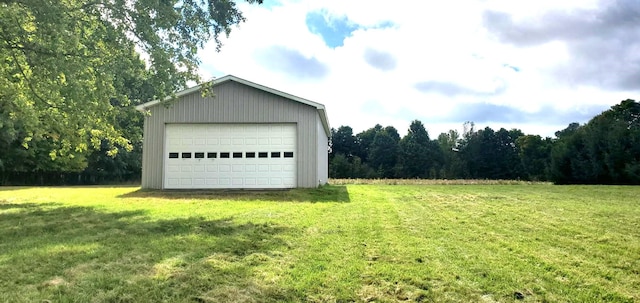 garage featuring a lawn