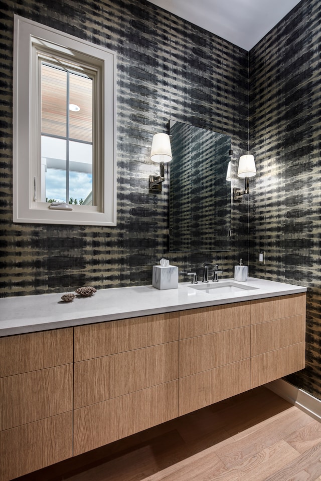 bathroom featuring sink and hardwood / wood-style flooring