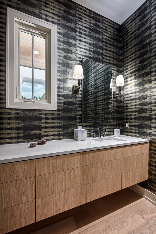 827 Larchlea Dr, Birmingham, MI 48009 - bathroom with double vanity, wood finished floors, and wallpapered walls