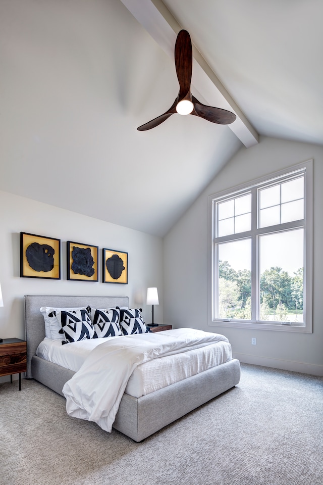 bedroom with ceiling fan, carpet, and lofted ceiling with beams