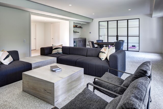 827 Larchlea Dr, Birmingham, MI 48009 - living area with light colored carpet, a dry bar, and recessed lighting