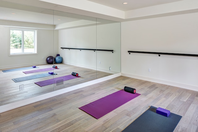 workout area with light wood-type flooring