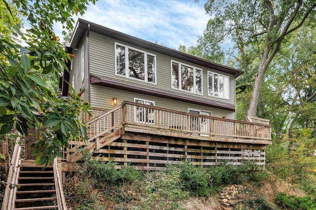 back of house featuring a deck