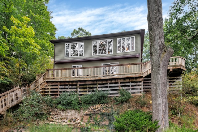 back of house with a wooden deck