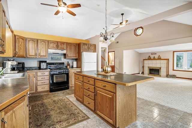 kitchen featuring a center island, light carpet, lofted ceiling with beams, white refrigerator, and black gas stove