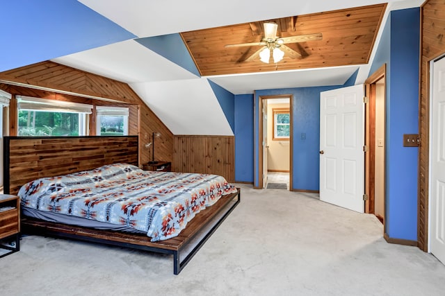 bedroom with carpet flooring, ceiling fan, wood walls, lofted ceiling, and wood ceiling