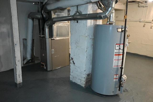 utility room featuring heating unit and gas water heater