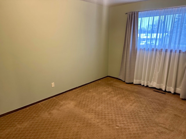 view of carpeted spare room