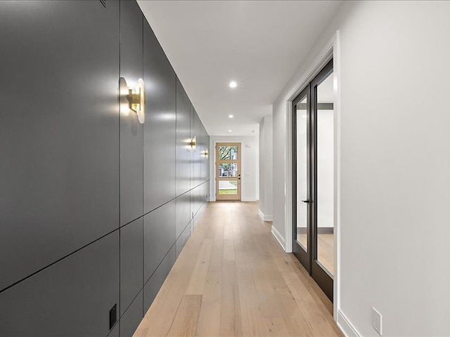 corridor featuring light hardwood / wood-style floors