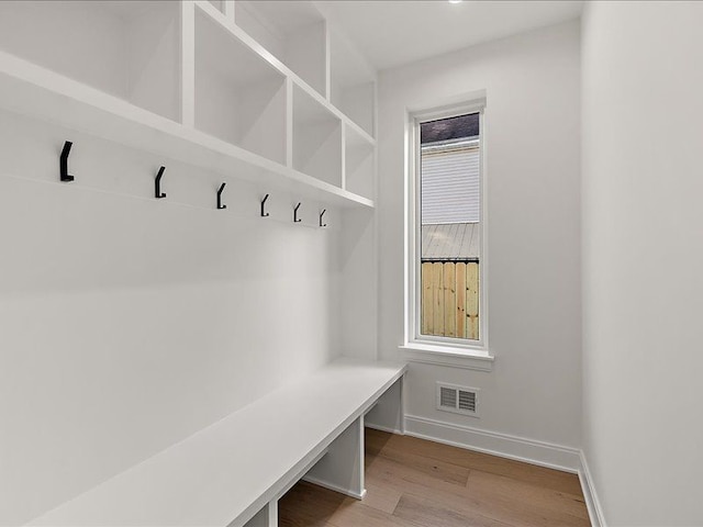 mudroom with light hardwood / wood-style flooring