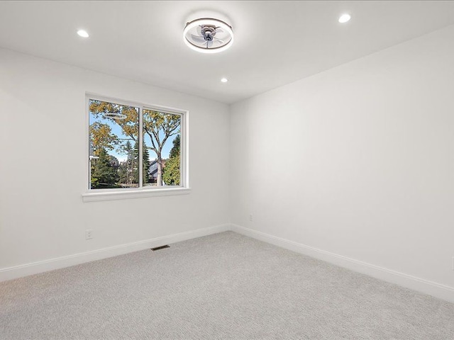 unfurnished room with carpet flooring