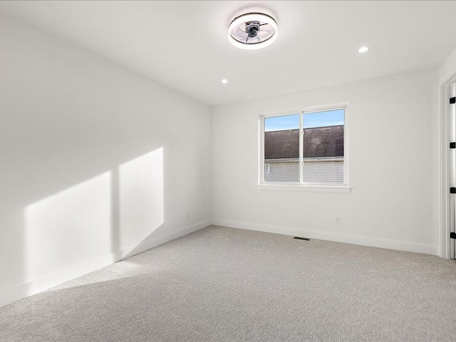 unfurnished room with carpet floors