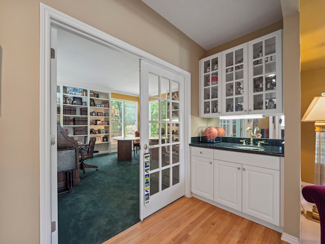 interior space with light colored carpet and sink