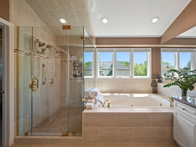 bathroom with separate shower and tub and vaulted ceiling