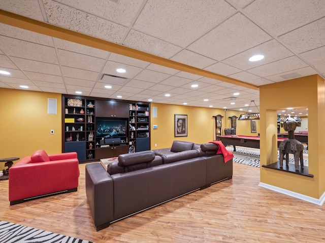 living room with light hardwood / wood-style flooring, built in features, and pool table