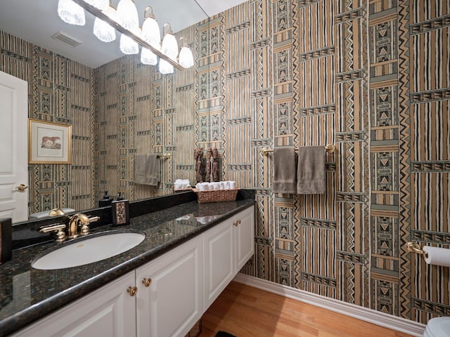 bathroom featuring hardwood / wood-style floors and vanity