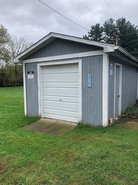 garage with a yard