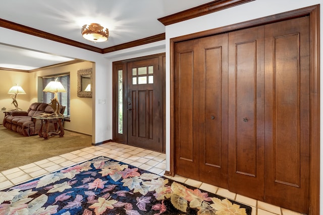 foyer entrance featuring light carpet and crown molding