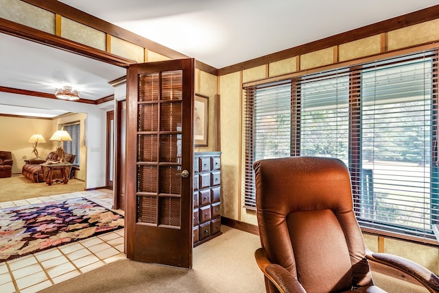 office space featuring crown molding and light carpet