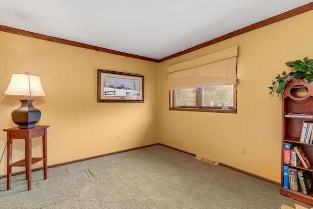 spare room with carpet and ornamental molding