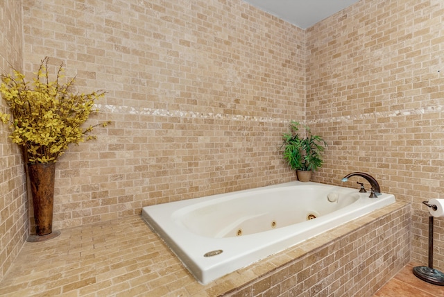 bathroom with tiled bath