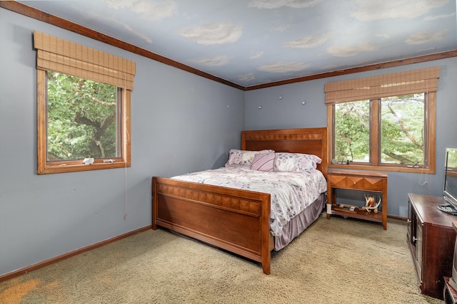 carpeted bedroom with ornamental molding