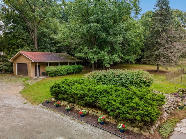 view of front facade featuring a garage and a front lawn