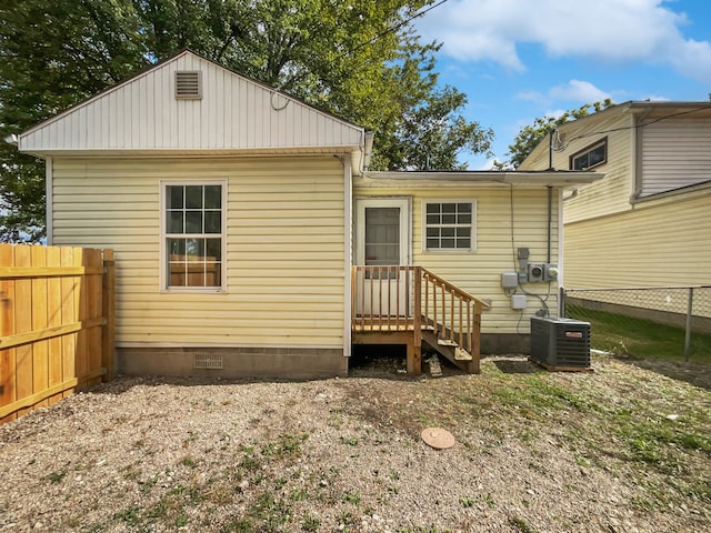 rear view of property with central air condition unit