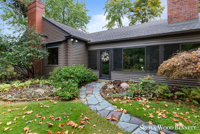 property entrance with a yard