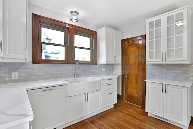 kitchen featuring white cabinets, dark hardwood / wood-style floors, sink, and tasteful backsplash