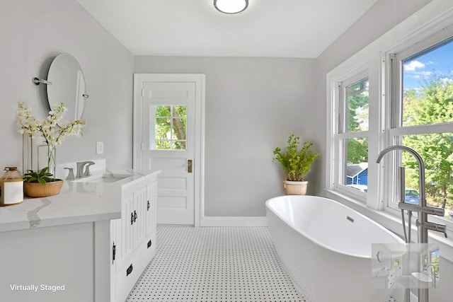 bathroom featuring a bathing tub and vanity