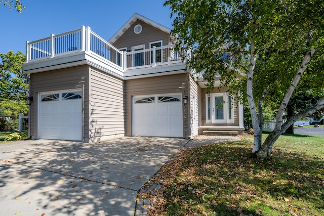 view of front property with a balcony and a garage