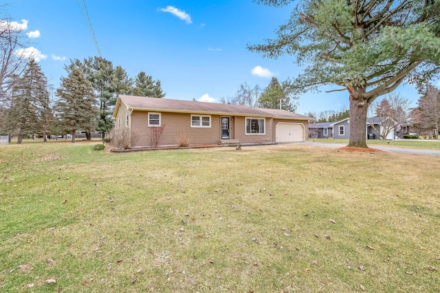 single story home featuring a garage and a front yard