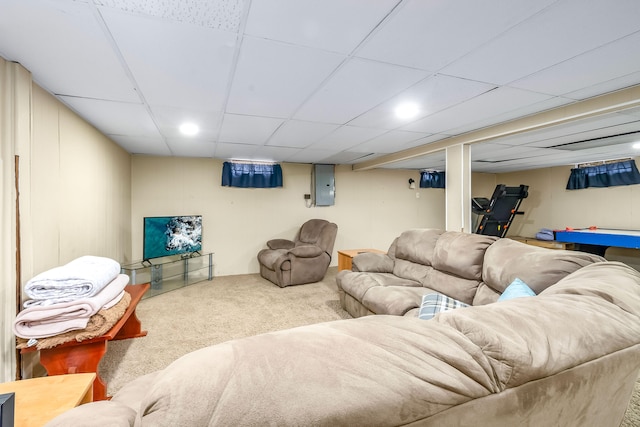 living room with a paneled ceiling, carpet flooring, and electric panel