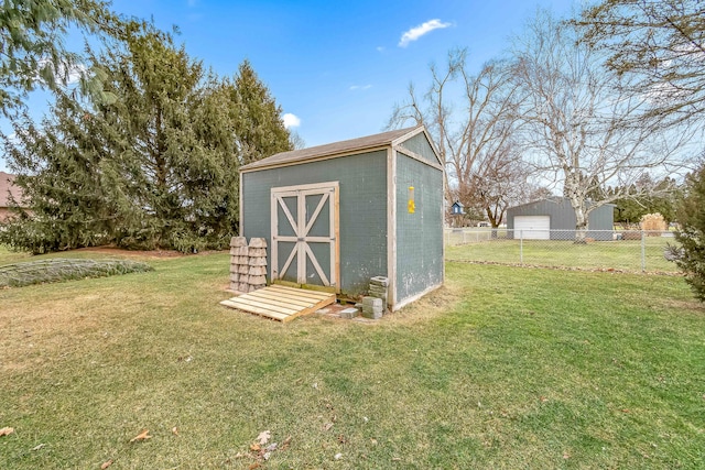 view of outdoor structure featuring a lawn