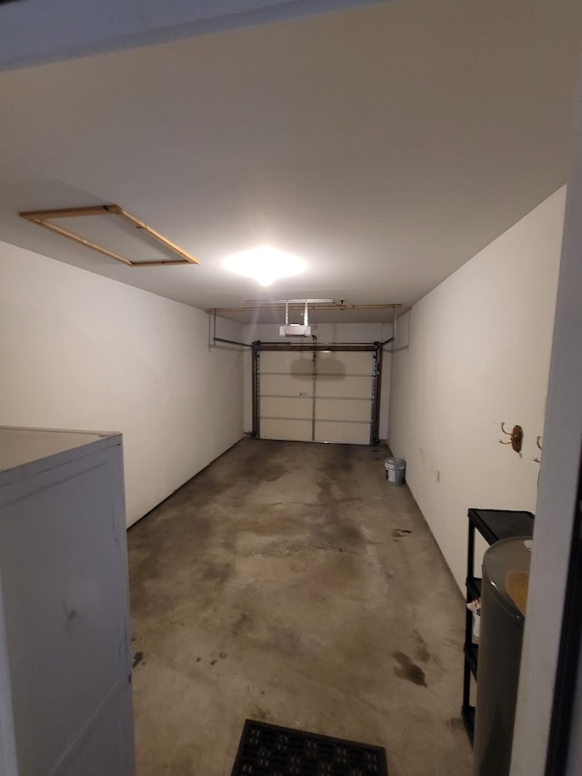 garage featuring refrigerator and a garage door opener