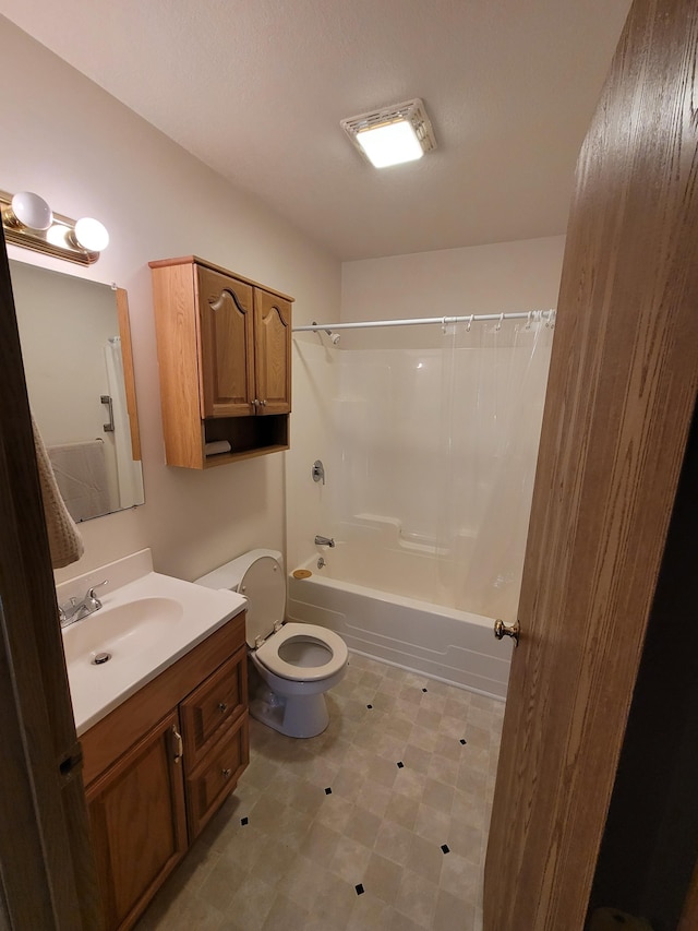 full bathroom featuring shower / tub combination, vanity, and toilet