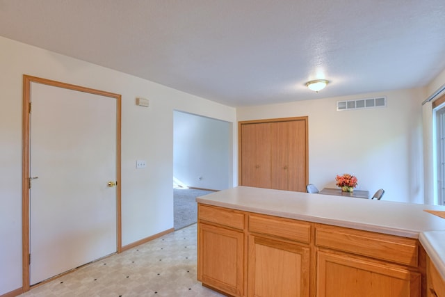 kitchen featuring a textured ceiling