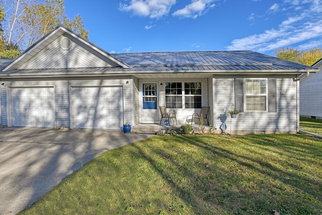 ranch-style house featuring a front yard and a garage