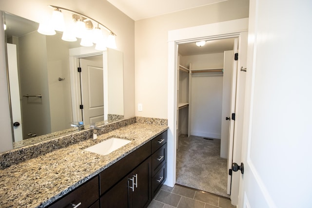 bathroom featuring tile patterned floors and vanity