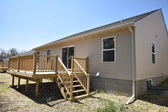 back of house with a wooden deck