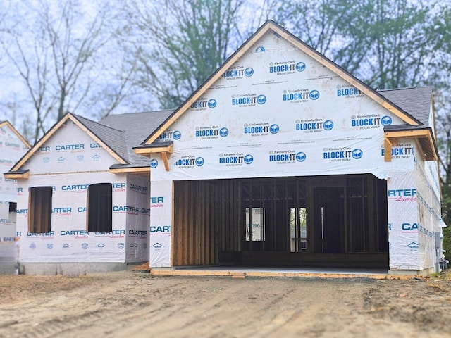 11441 Hidden Oaks Dr, Clio, MI 48420 - property in mid-construction featuring a shingled roof