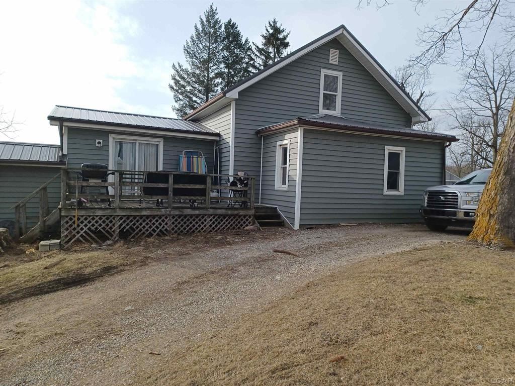 rear view of property with a deck