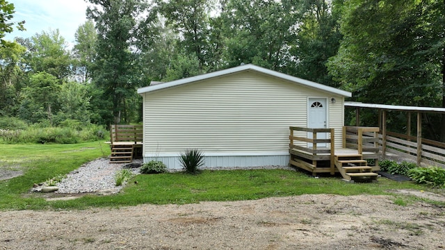 view of home's exterior with a wooden deck