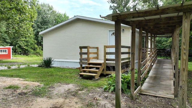 view of side of property with a lawn