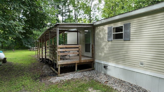 wooden deck with a yard