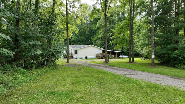 view of yard featuring a wooden deck