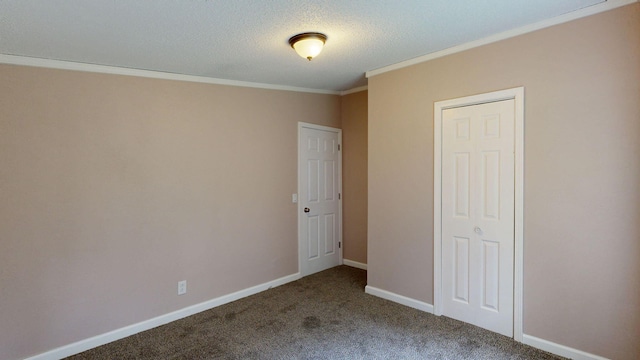 unfurnished bedroom with carpet, crown molding, and a textured ceiling