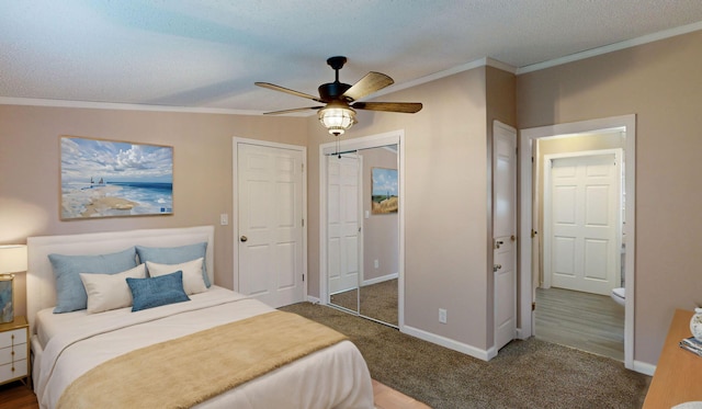 carpeted bedroom with lofted ceiling, ceiling fan, a textured ceiling, and ornamental molding