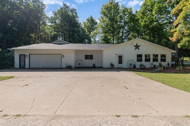 ranch-style home featuring a garage